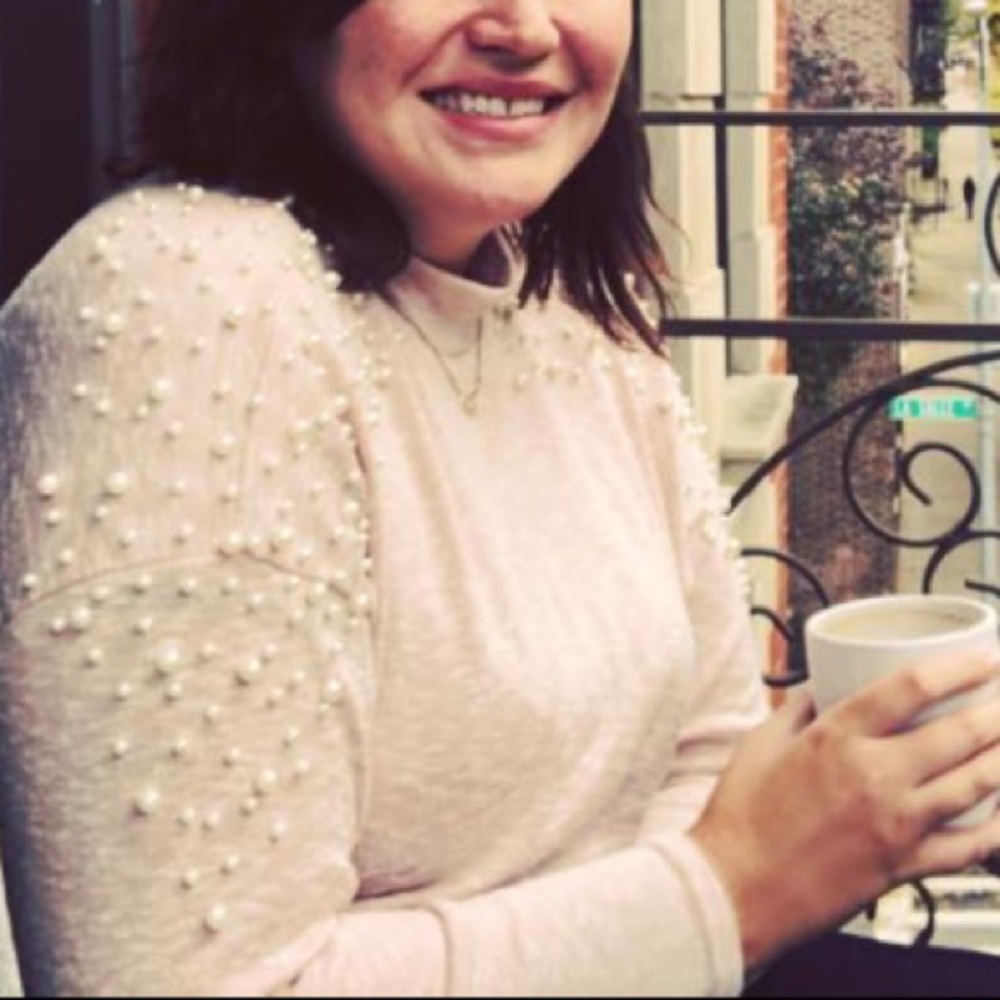 Pearl-studded pink turtleneck